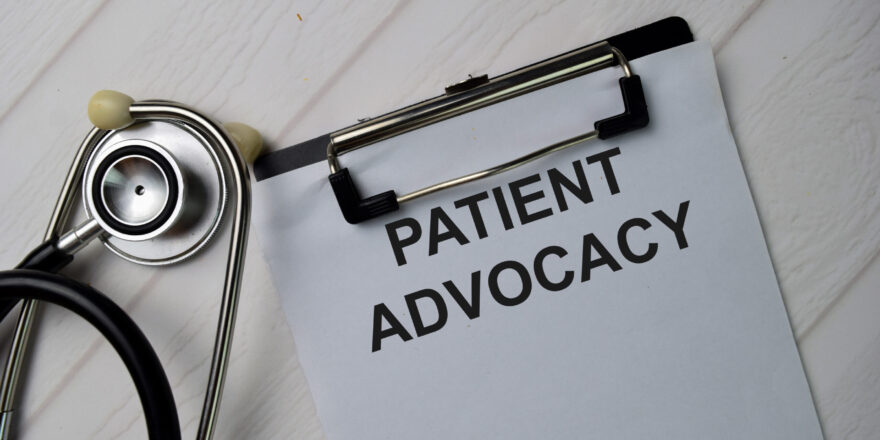 Patient Advocacy text write on a paperwork isolated on office desk.